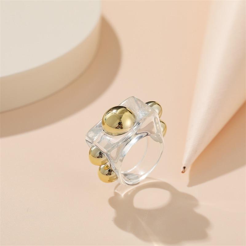 Modern Acrylic Ring with Golden Metallic Details