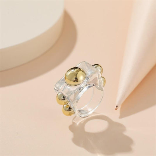 Modern Acrylic Ring with Golden Metallic Details