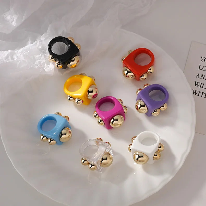 Modern Acrylic Ring with Golden Metallic Details